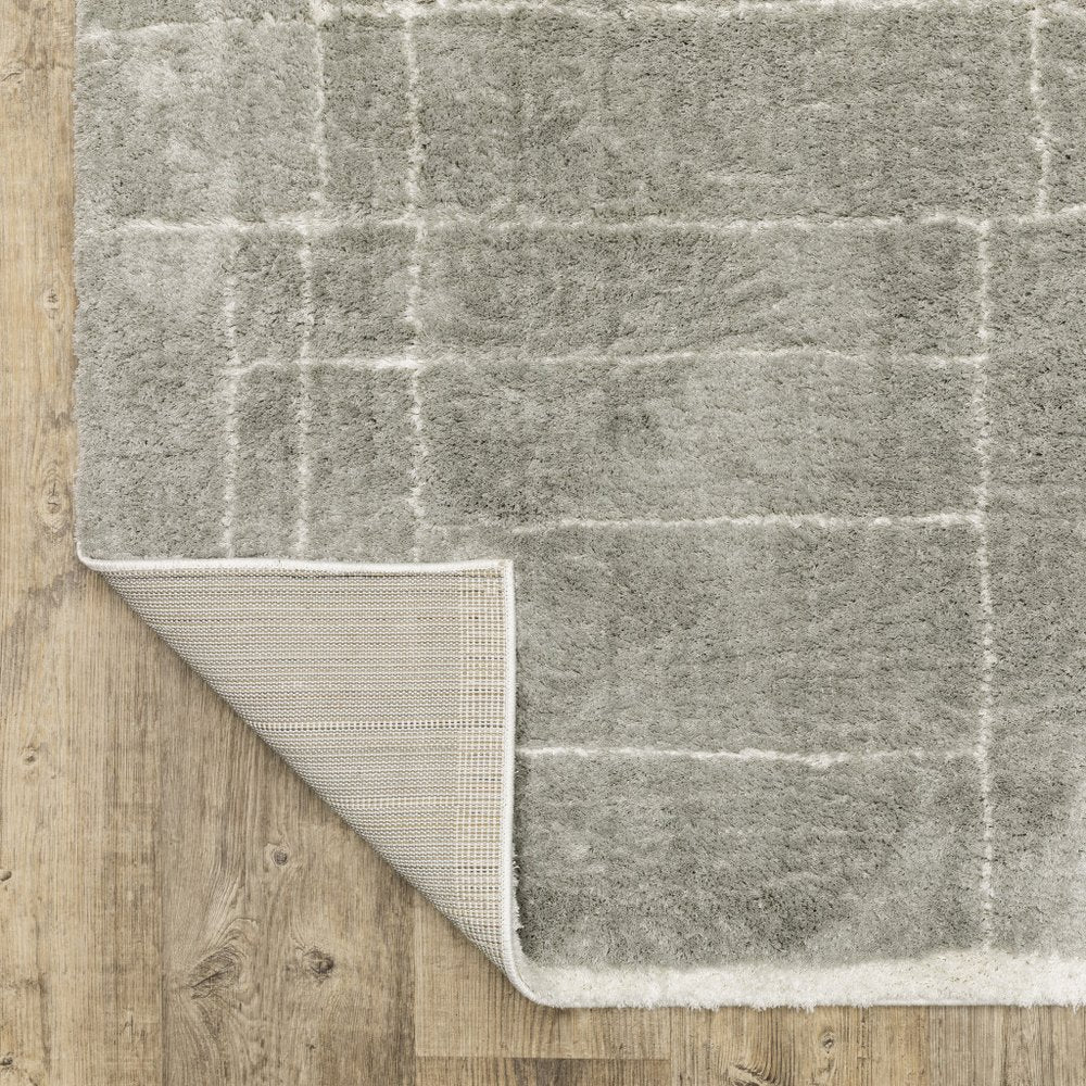 6' X 9' Grey And Ivory Geometric Shag Power Loom Stain Resistant Area Rug