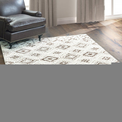 2' X 3' Ivory And Brown Geometric Shag Power Loom Stain Resistant Area Rug