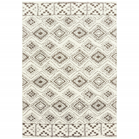 7' X 10' Ivory And Brown Geometric Shag Area Rug