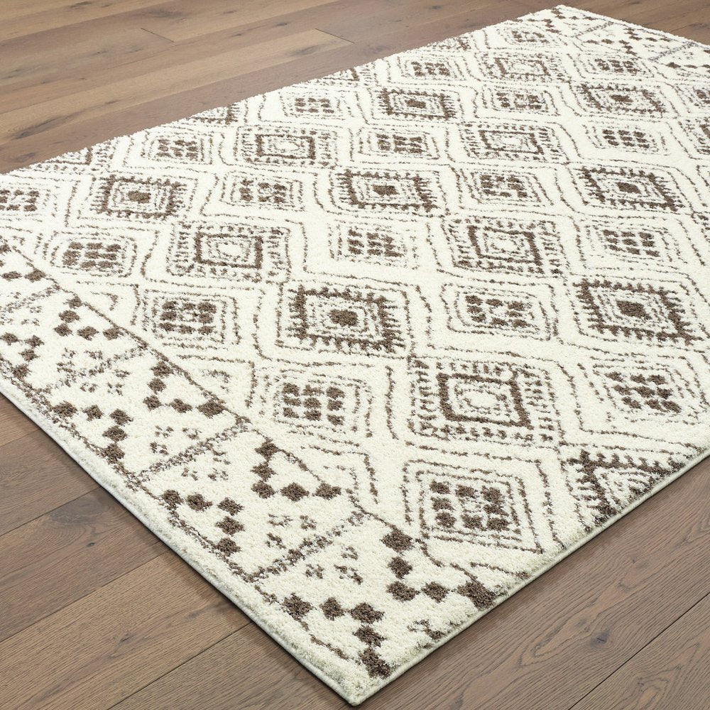 7' X 10' Ivory And Brown Geometric Shag Area Rug