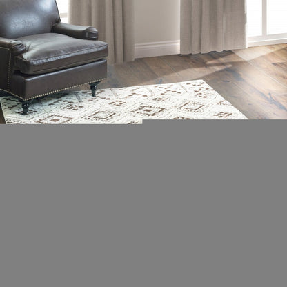 10' X 13' Ivory And Brown Geometric Shag Power Loom Stain Resistant Area Rug