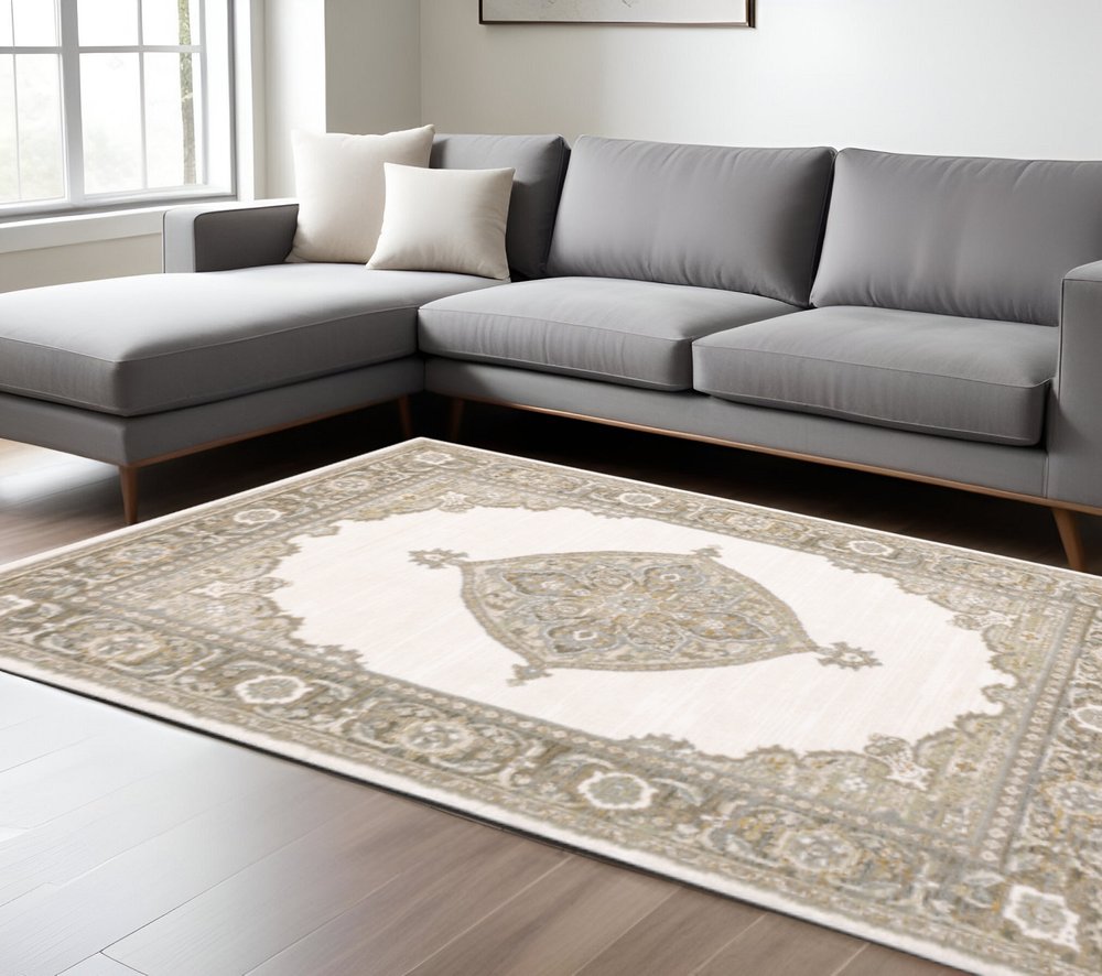 7' X 10' Beige and Ivory Oriental Power Loom Area Rug