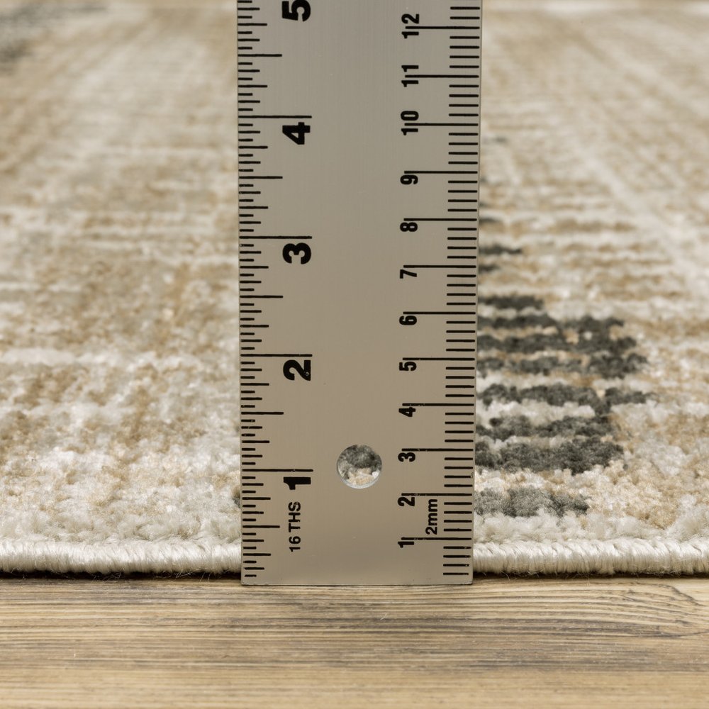 5' X 8' Beige Ivory Charcoal Brown Tan And Grey Abstract Power Loom Stain Resistant Area Rug With Fringe
