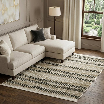 6' X 9' Beige Ivory Charcoal Brown Tan And Grey Abstract Power Loom Stain Resistant Area Rug With Fringe