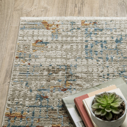 4' X 6' Beige Grey Brown Gold Red And Blue Abstract Power Loom Stain Resistant Area Rug With Fringe