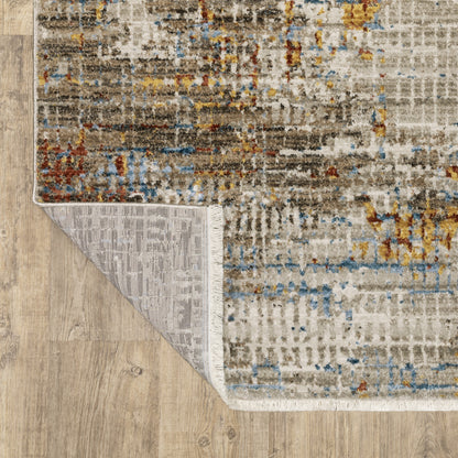 5' X 8' Beige Grey Brown Gold Red And Blue Abstract Power Loom Stain Resistant Area Rug With Fringe