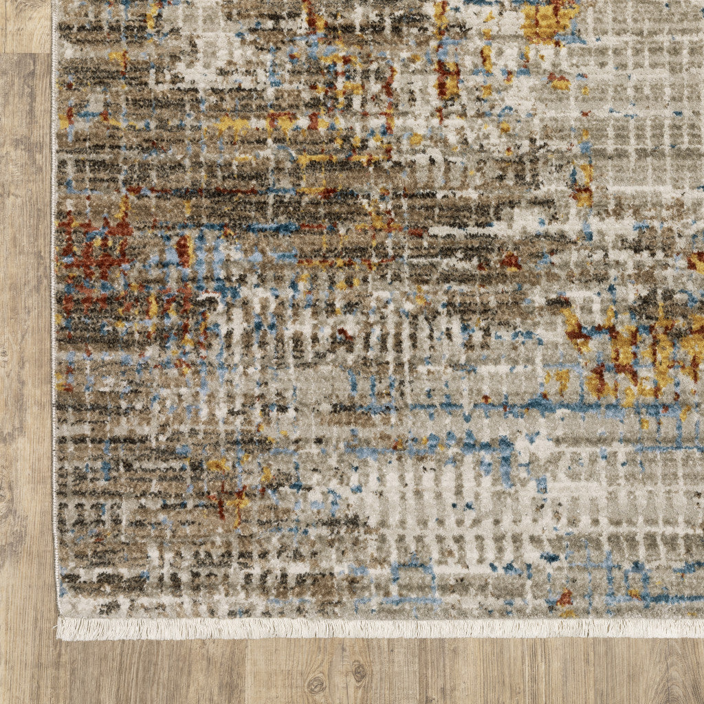 6' X 9' Beige Grey Brown Gold Red And Blue Abstract Power Loom Stain Resistant Area Rug With Fringe