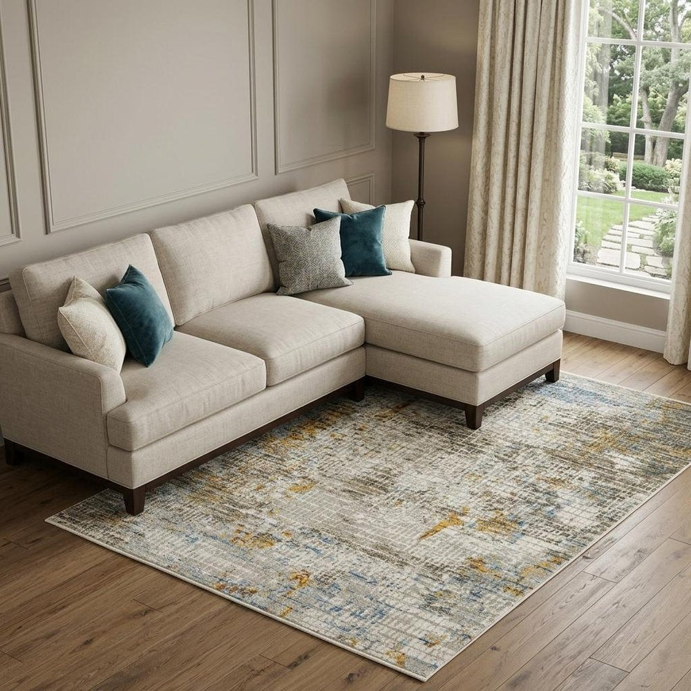 8' X 11' Beige Grey Brown Gold Red And Blue Abstract Power Loom Stain Resistant Area Rug With Fringe