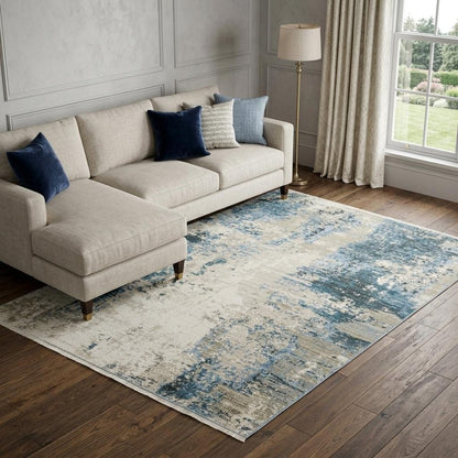 8' X 11' Blue Grey Ivory Light Blue And Dark Blue Abstract Power Loom Stain Resistant Area Rug With Fringe