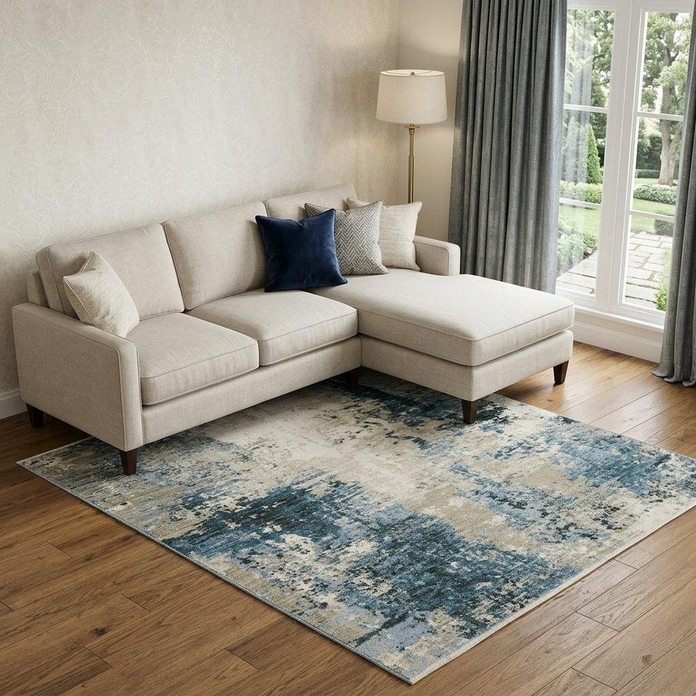 8' X 11' Blue Grey Ivory Light Blue And Dark Blue Abstract Power Loom Stain Resistant Area Rug With Fringe