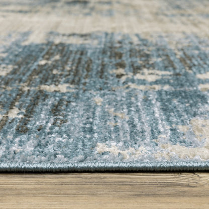 8' X 11' Blue Grey Ivory Light Blue And Dark Blue Abstract Power Loom Stain Resistant Area Rug With Fringe
