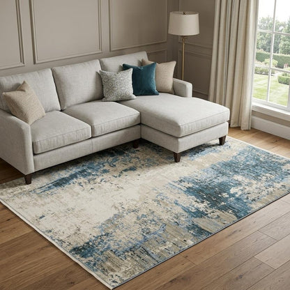 10' X 13' Blue Grey Ivory Light Blue And Dark Blue Abstract Power Loom Stain Resistant Area Rug With Fringe