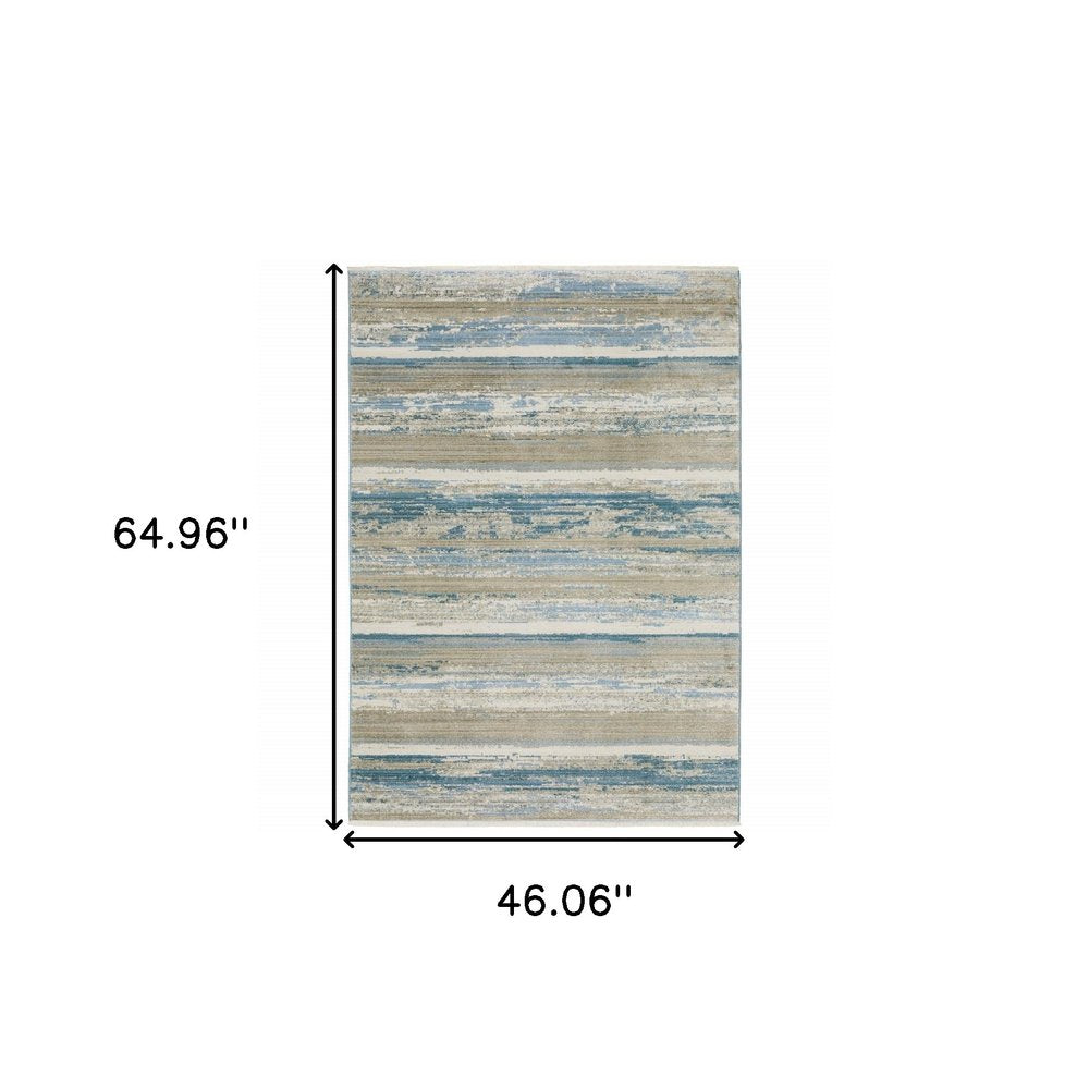 4' X 6' Ivory Beige Grey Blue And Tan Abstract Power Loom Stain Resistant Area Rug With Fringe