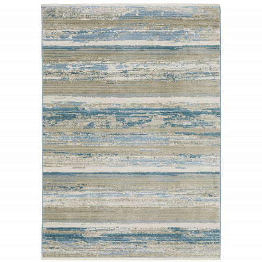 6' X 9' Ivory Beige Grey Blue And Tan Abstract Power Loom Stain Resistant Area Rug With Fringe