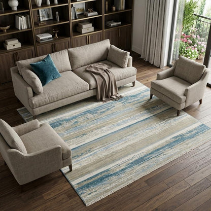 6' X 9' Ivory Beige Grey Blue And Tan Abstract Power Loom Stain Resistant Area Rug With Fringe