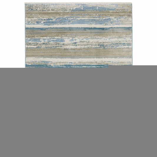 8' X 11' Ivory Beige Grey Blue And Tan Abstract Power Loom Stain Resistant Area Rug With Fringe
