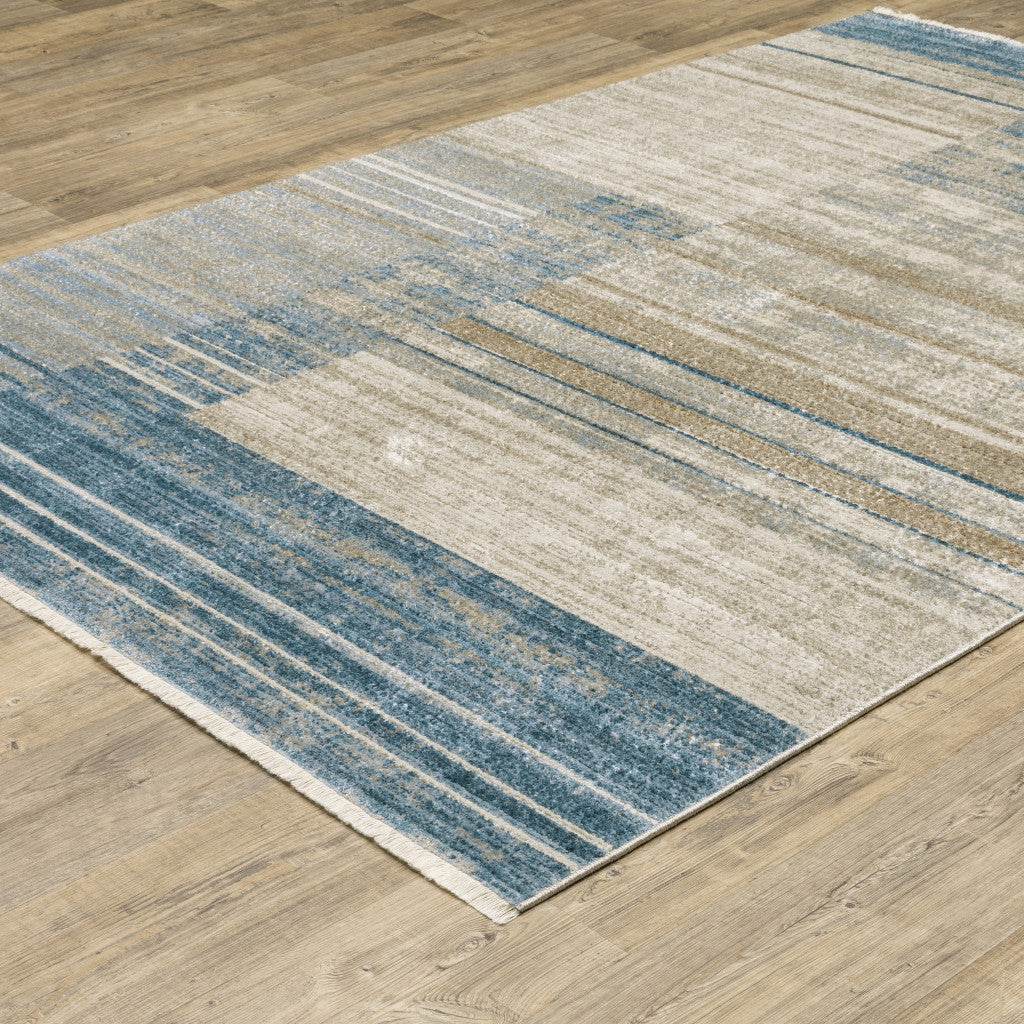 4' X 6' Blue Dark Blue Teal Grey Ivory Beige And Tan Geometric Power Loom Stain Resistant Area Rug With Fringe