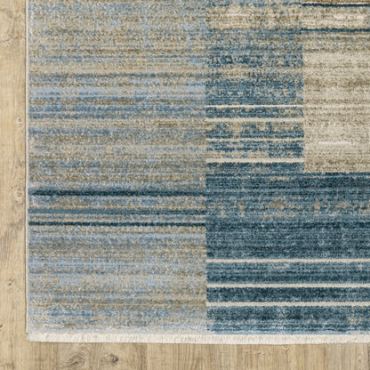 4' X 6' Blue Dark Blue Teal Grey Ivory Beige And Tan Geometric Power Loom Stain Resistant Area Rug With Fringe