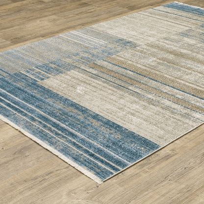 6' X 9' Blue Dark Blue Teal Grey Ivory Beige And Tan Geometric Power Loom Stain Resistant Area Rug With Fringe