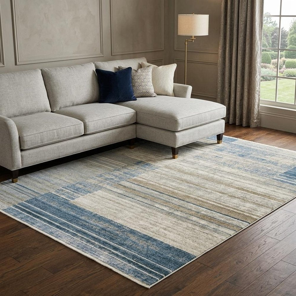 8' X 11' Blue Dark Blue Teal Grey Ivory Beige And Tan Geometric Power Loom Stain Resistant Area Rug With Fringe