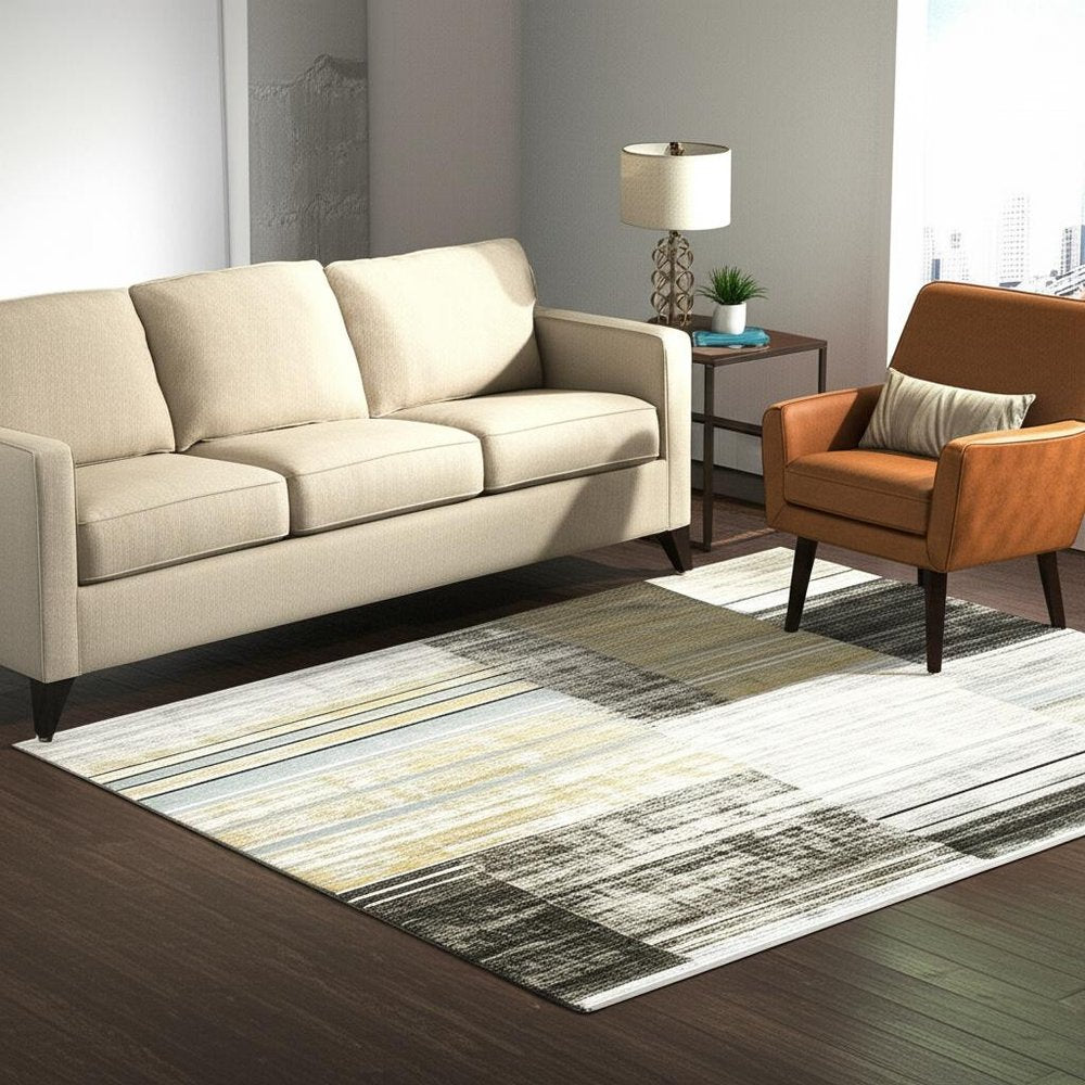 5' X 8' Beige Charcoal Brown Grey Tan Gold And Blue Geometric Power Loom Stain Resistant Area Rug With Fringe