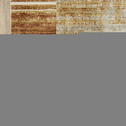 4' X 6' Rust Gold Blue Grey Ivory And Tan Geometric Power Loom Stain Resistant Area Rug With Fringe