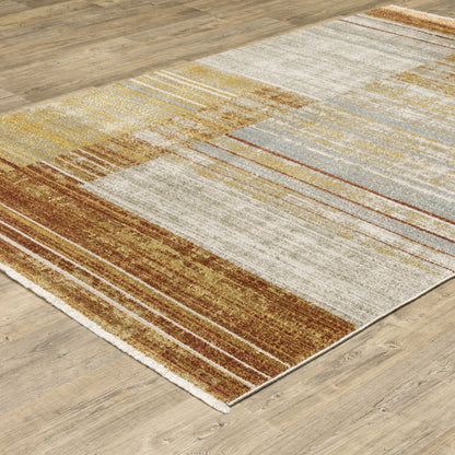 6' X 9' Rust Gold Blue Grey Ivory And Tan Geometric Power Loom Stain Resistant Area Rug With Fringe