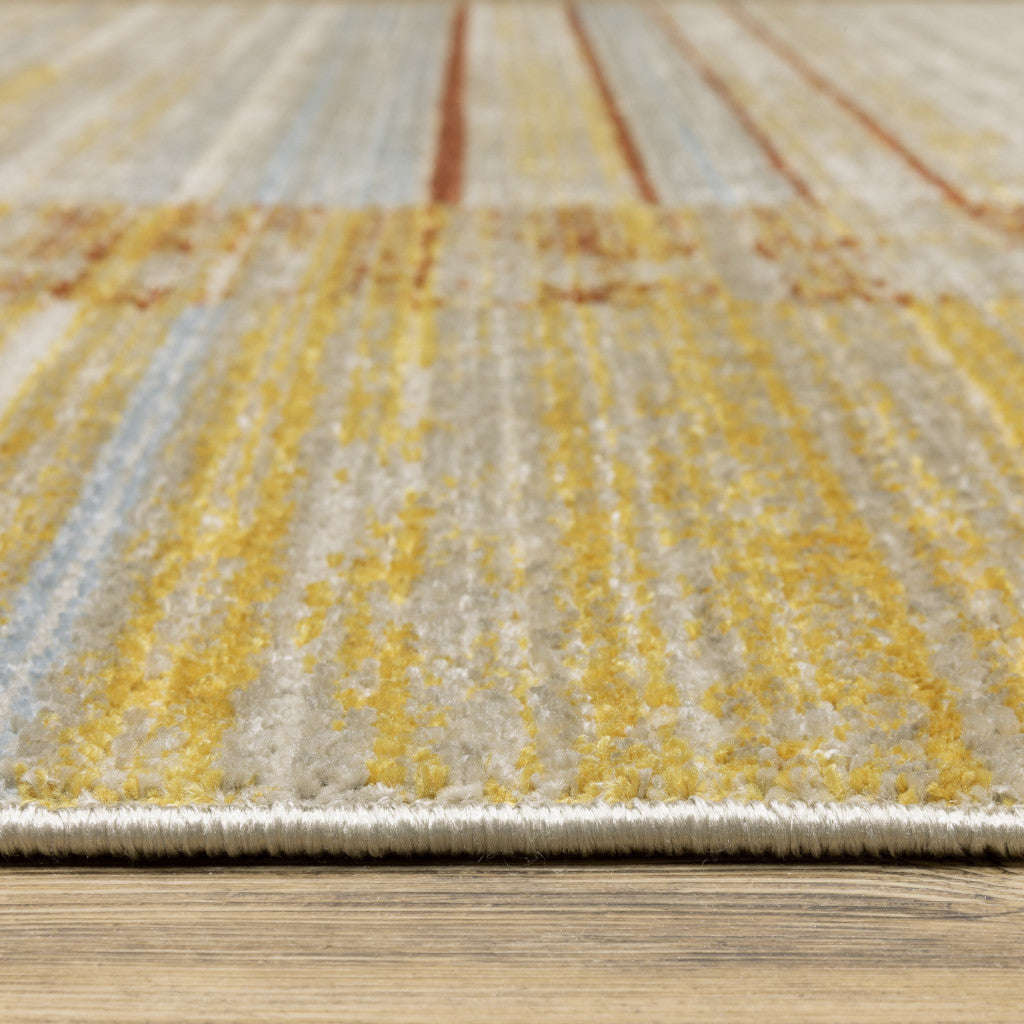 6' X 9' Rust Gold Blue Grey Ivory And Tan Geometric Power Loom Stain Resistant Area Rug With Fringe