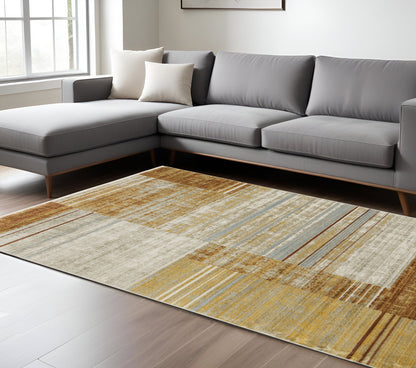 8' X 11' Rust Gold Blue Grey Ivory And Tan Geometric Power Loom Stain Resistant Area Rug With Fringe