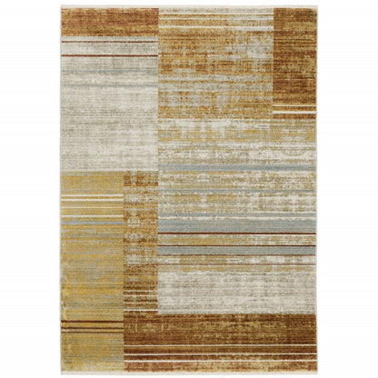 8' X 11' Rust Gold Blue Grey Ivory And Tan Geometric Power Loom Stain Resistant Area Rug With Fringe