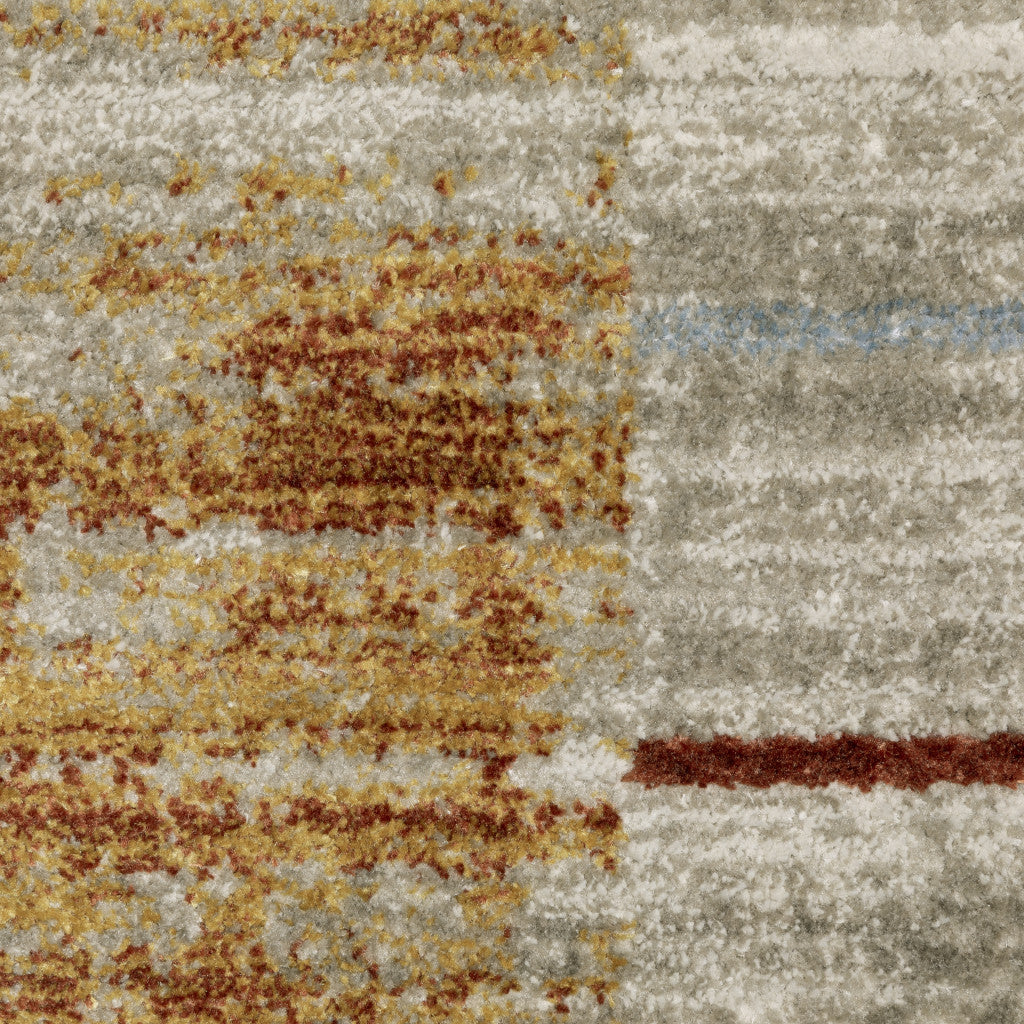 8' X 11' Rust Gold Blue Grey Ivory And Tan Geometric Power Loom Stain Resistant Area Rug With Fringe