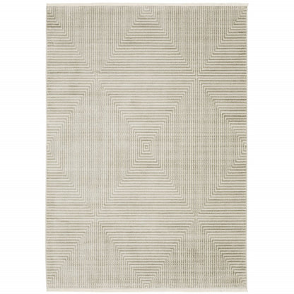 4' X 6' Ivory Beige Taupe And Tan Geometric Power Loom Stain Resistant Area Rug With Fringe