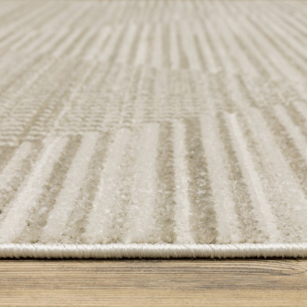 4' X 6' Ivory Beige Taupe And Tan Geometric Power Loom Stain Resistant Area Rug With Fringe