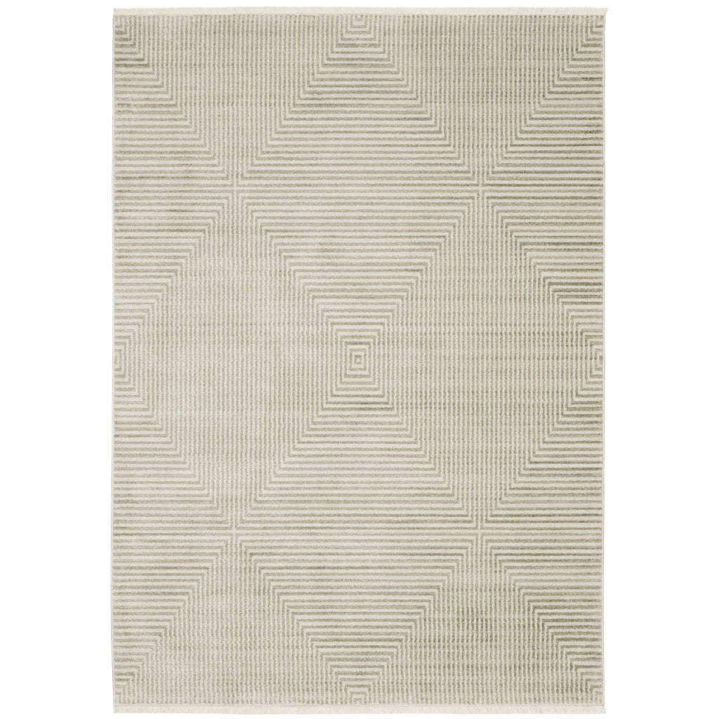 5' X 8' Ivory Beige Taupe And Tan Geometric Power Loom Stain Resistant Area Rug With Fringe