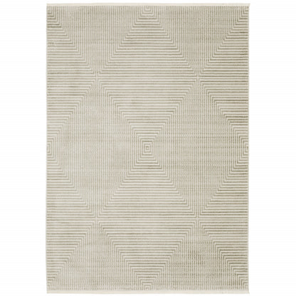 5' X 8' Ivory Beige Taupe And Tan Geometric Power Loom Stain Resistant Area Rug With Fringe