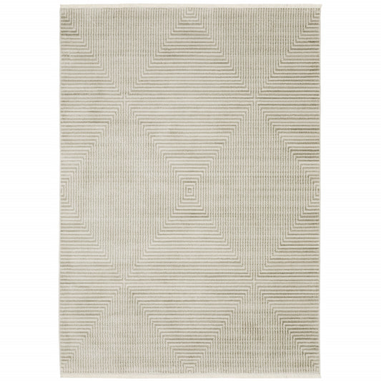 5' X 8' Ivory Beige Taupe And Tan Geometric Power Loom Stain Resistant Area Rug With Fringe