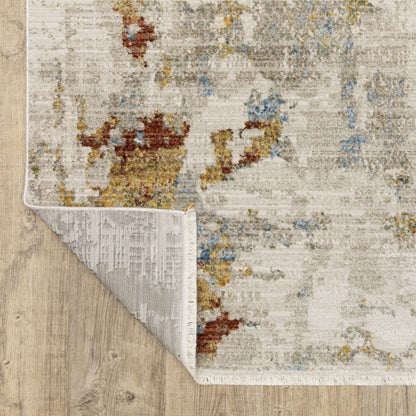 5' X 8' Beige Grey Gold Blue Rust And Teal Abstract Power Loom Stain Resistant Area Rug With Fringe