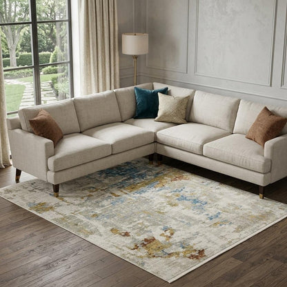 8' X 11' Beige Grey Gold Blue Rust And Teal Abstract Power Loom Stain Resistant Area Rug With Fringe