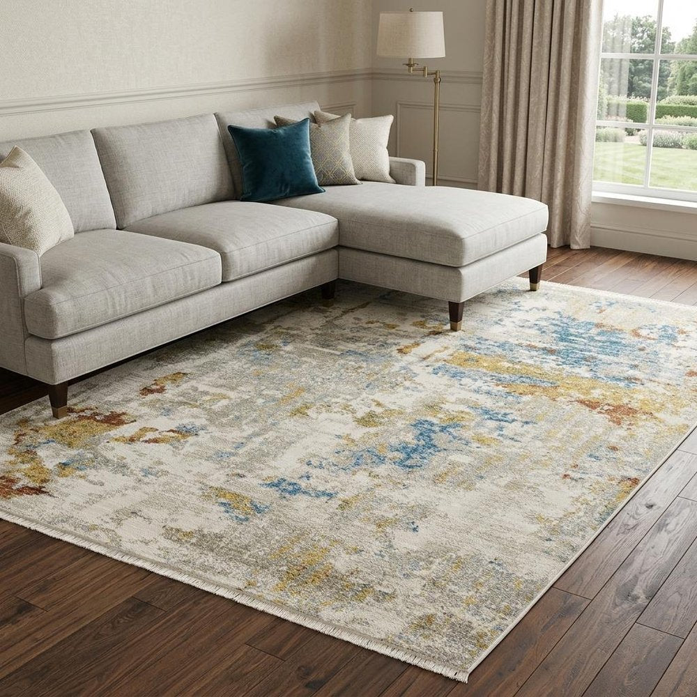 8' X 11' Beige Grey Gold Blue Rust And Teal Abstract Power Loom Stain Resistant Area Rug With Fringe