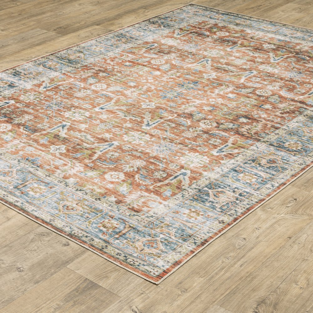 5' X 7' Rust Blue Ivory And Gold Oriental Printed Stain Resistant Non Skid Area Rug