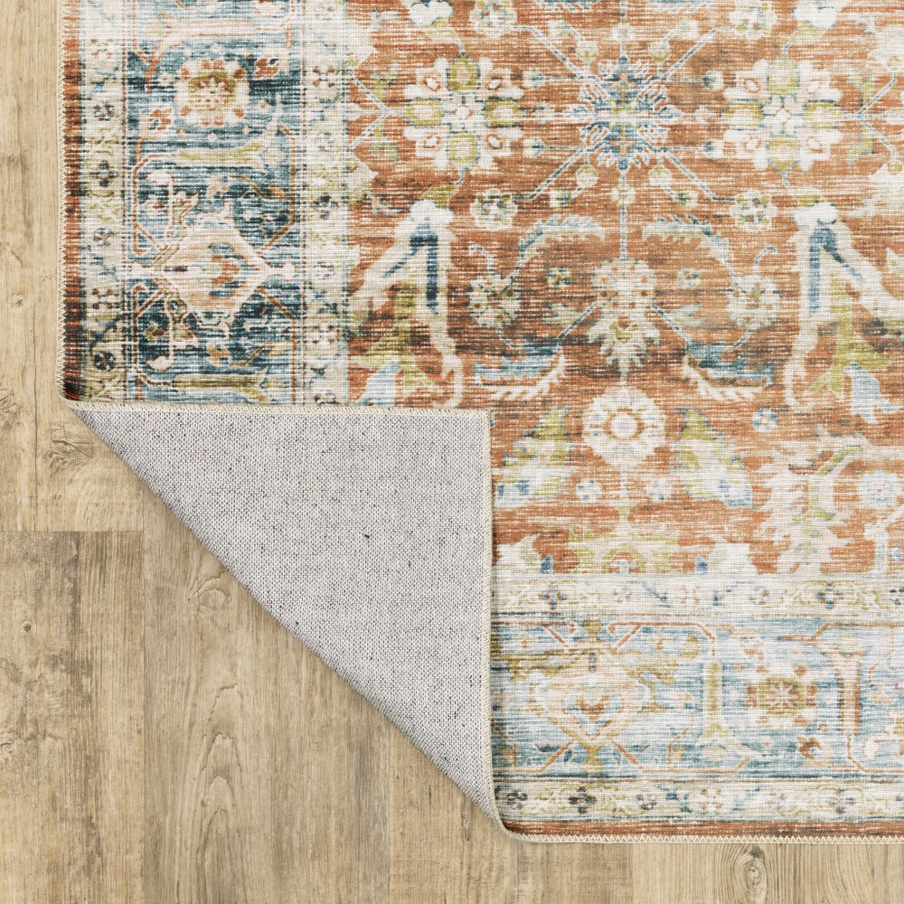 5' X 7' Rust Blue Ivory And Gold Oriental Printed Stain Resistant Non Skid Area Rug