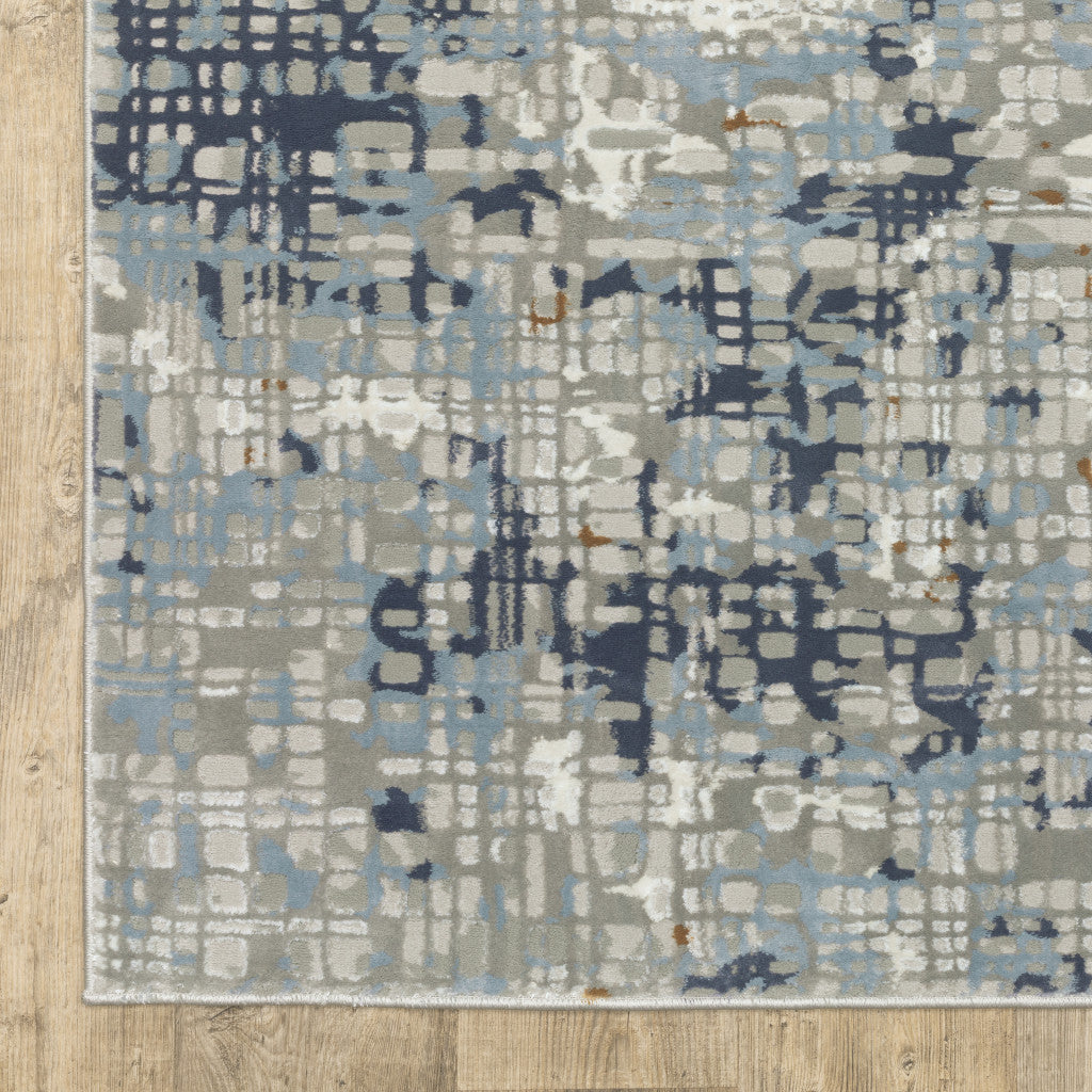 8' X 11' Blue Ivory Grey Brown Beige And Light Blue Abstract Power Loom Stain Resistant Area Rug