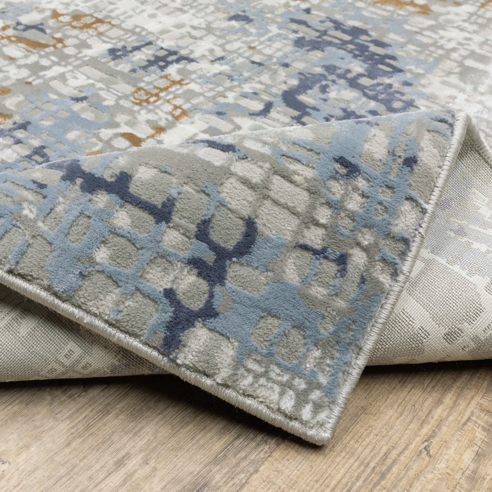 8' X 11' Blue Ivory Grey Brown Beige And Light Blue Abstract Power Loom Stain Resistant Area Rug