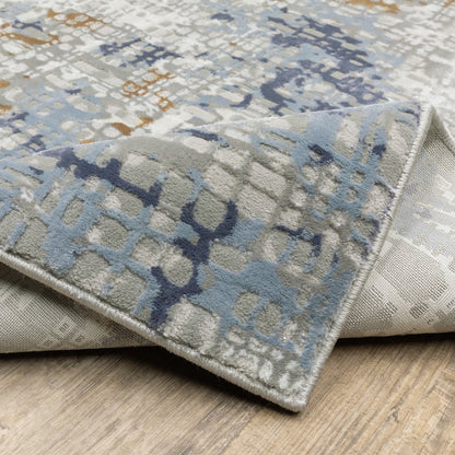 8' X 11' Blue Ivory Grey Brown Beige And Light Blue Abstract Power Loom Stain Resistant Area Rug