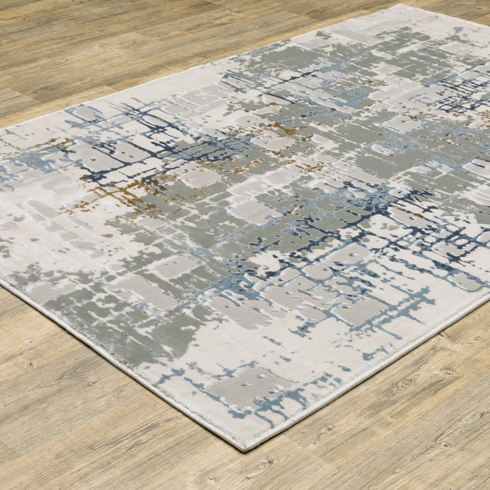 8' X 11' Grey Blue Brown Ivory And Deep Blue Abstract Power Loom Stain Resistant Area Rug