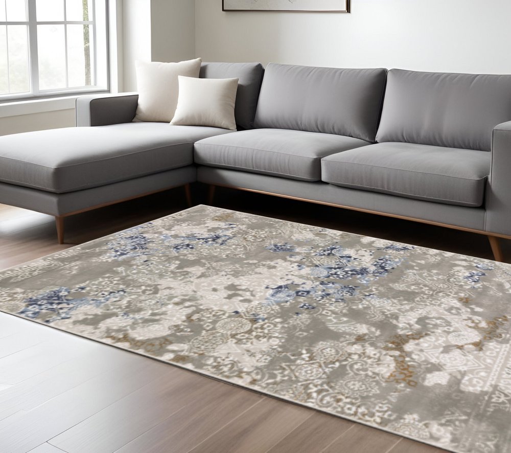 8' X 11' Grey Blue Ivory Brown And Navy Abstract Power Loom Stain Resistant Area Rug