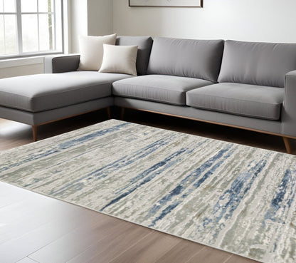 8' X 11' Blue Ivory Grey Light Blue And Brown Abstract Power Loom Stain Resistant Area Rug