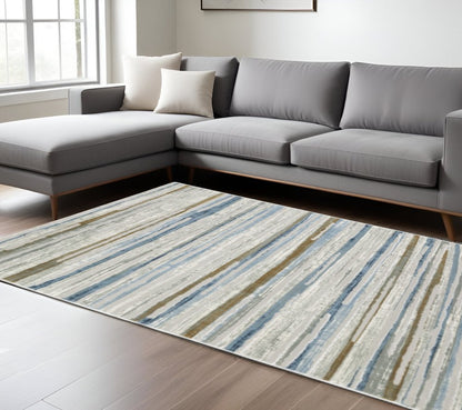 8' X 11' Grey Blue Ivory Brown Beige And Navy Abstract Power Loom Stain Resistant Area Rug