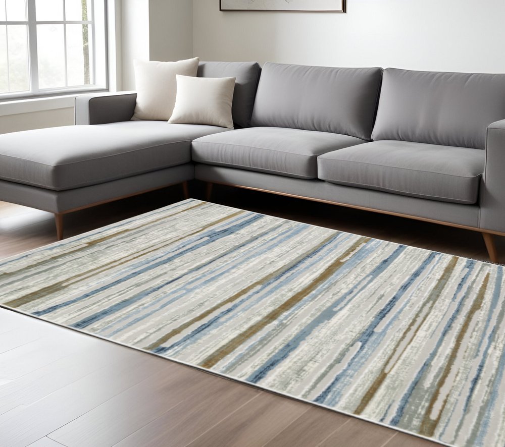 8' X 11' Grey Blue Ivory Brown Beige And Navy Abstract Power Loom Stain Resistant Area Rug