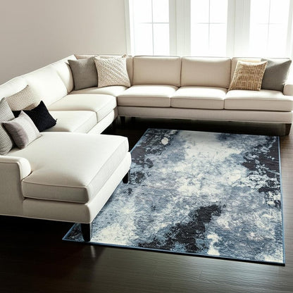 10' X 13' Blue and Ivory Abstract Power Loom Area Rug